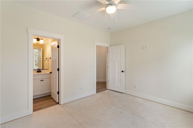 unfurnished bedroom with connected bathroom and ceiling fan