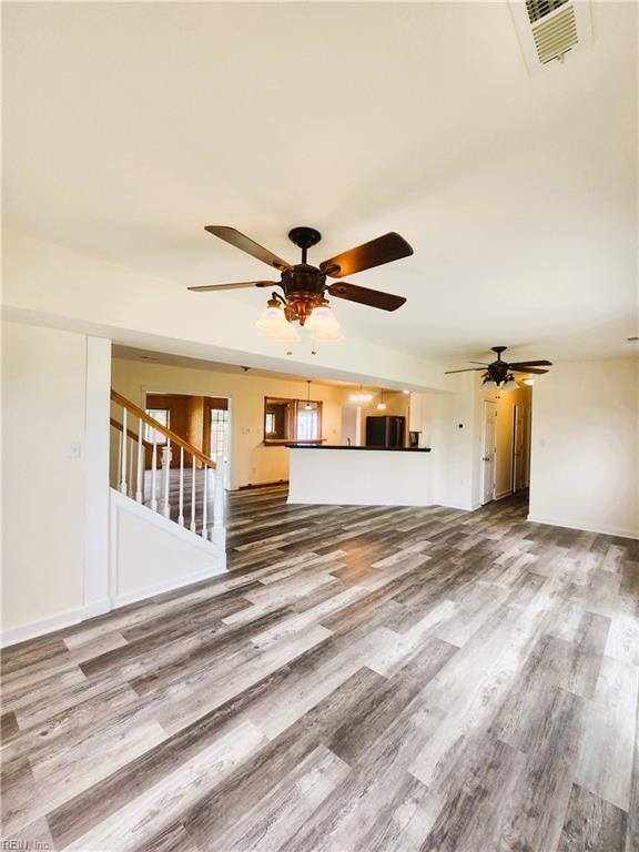 unfurnished living room with hardwood / wood-style floors