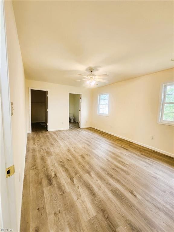 unfurnished room with ceiling fan and light hardwood / wood-style flooring