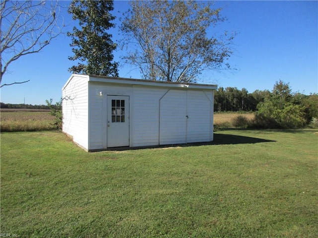 view of outbuilding with a lawn