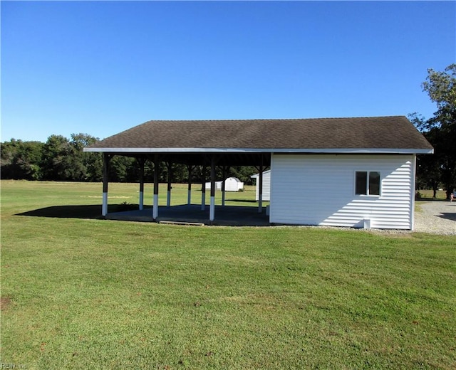 surrounding community featuring a carport and a lawn