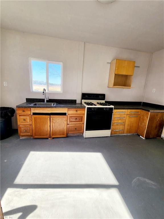 kitchen with white range oven and sink