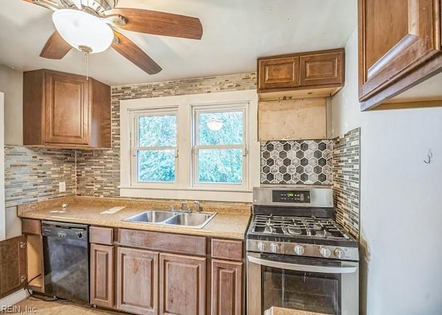 kitchen with black dishwasher, stainless steel gas stove, sink, and decorative backsplash