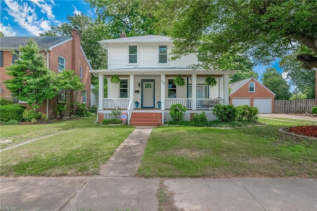 view of front facade featuring an outdoor structure, a garage, a front lawn, and a porch