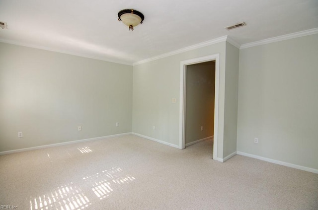 unfurnished room featuring crown molding and light colored carpet