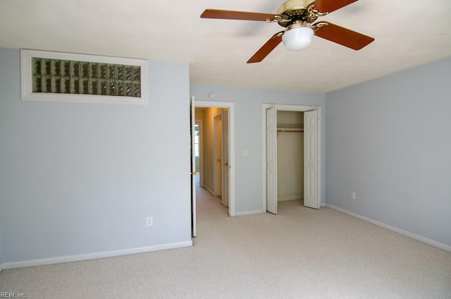 unfurnished bedroom with light colored carpet, a closet, and ceiling fan