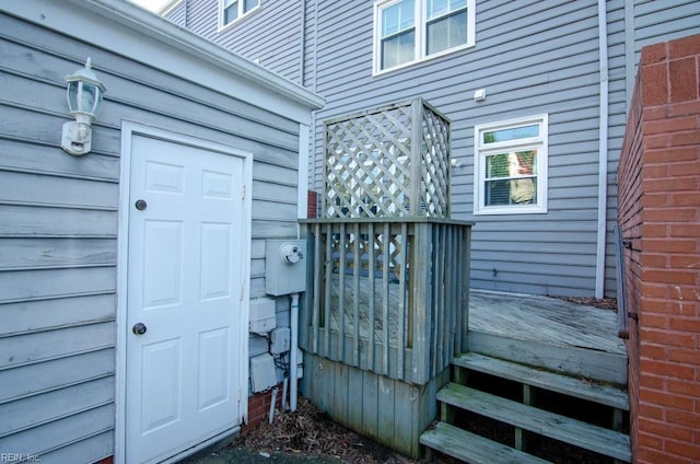 entrance to property with a wooden deck