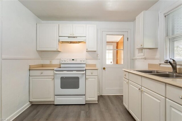 kitchen with sink, white electric range, dark hardwood / wood-style floors, and white cabinetry