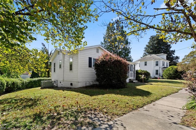 view of home's exterior featuring a lawn