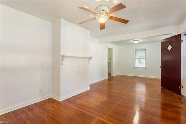 empty room featuring hardwood / wood-style flooring and ceiling fan