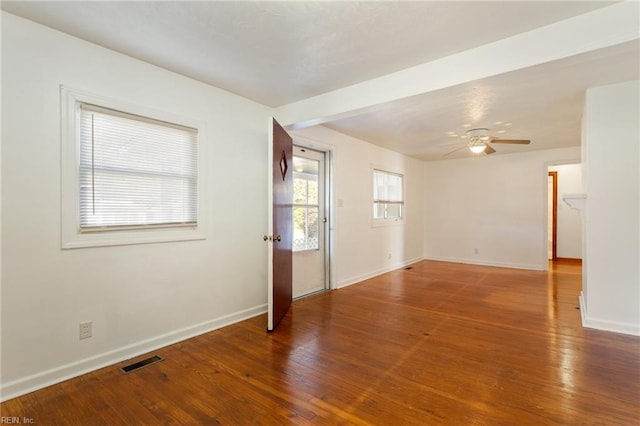 spare room with ceiling fan and hardwood / wood-style flooring