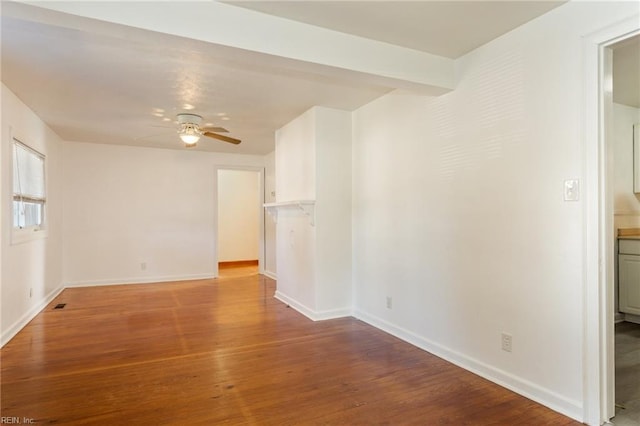 spare room with ceiling fan and hardwood / wood-style floors