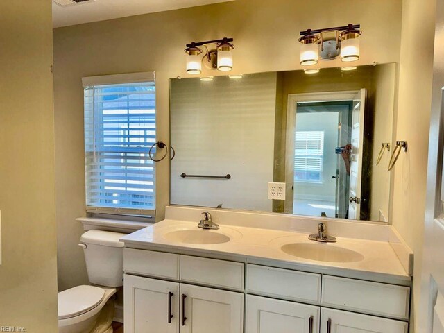 bathroom with vanity and toilet