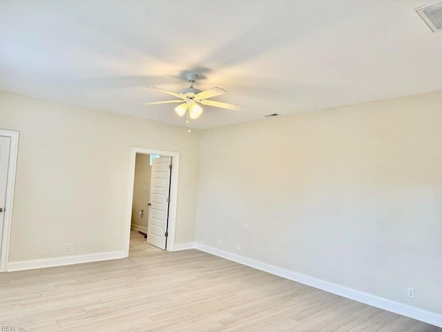 empty room featuring light wood-type flooring and ceiling fan