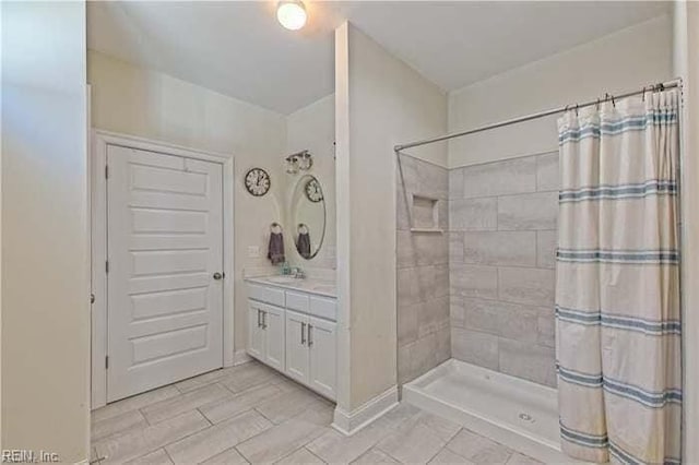 bathroom featuring vanity and a shower with curtain