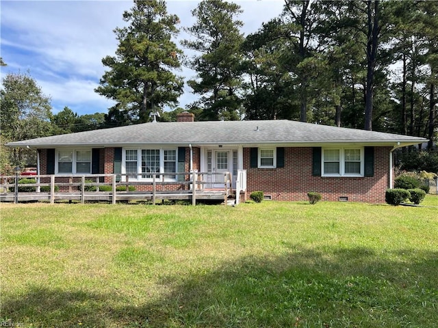 single story home featuring a front yard and a wooden deck