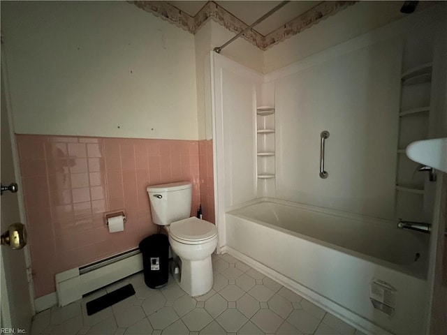 bathroom with toilet, shower / washtub combination, tile walls, and a baseboard radiator