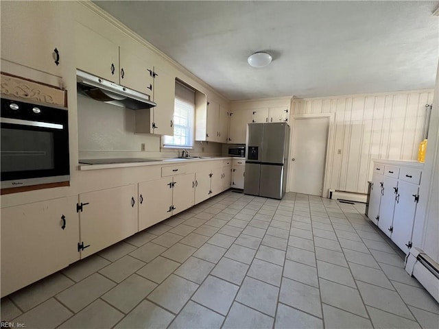 kitchen featuring stainless steel appliances, a baseboard heating unit, and white cabinets