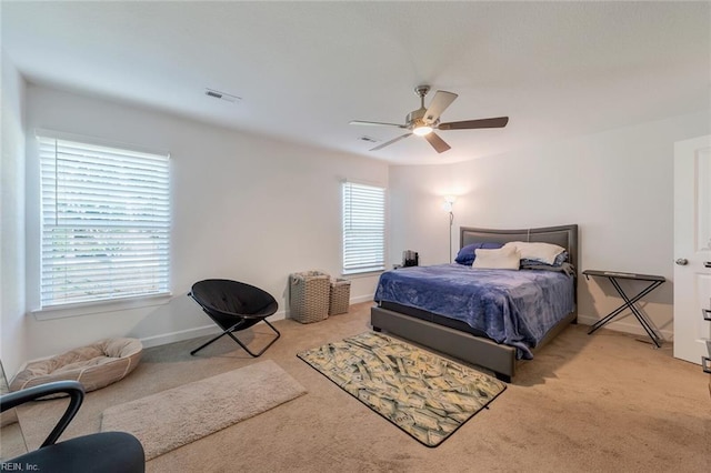 bedroom featuring ceiling fan and light colored carpet