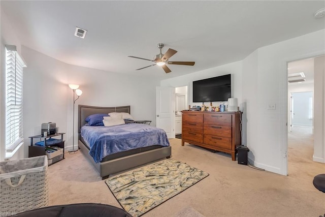 bedroom featuring light carpet and ceiling fan