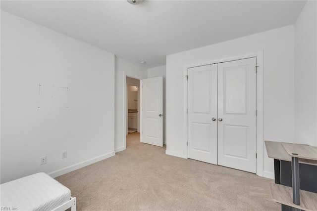 carpeted bedroom featuring a closet