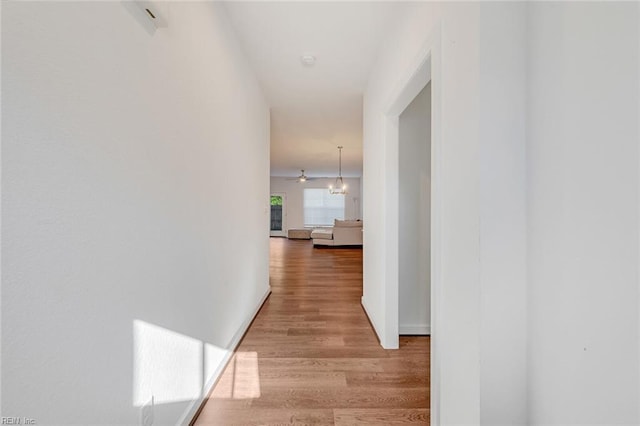 hallway with light wood-type flooring