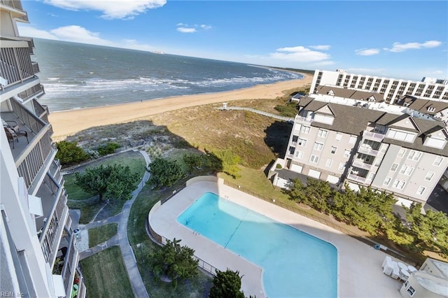 drone / aerial view featuring a water view and a view of the beach