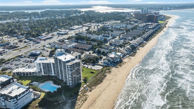 aerial view with a water view and a view of the beach