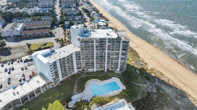 drone / aerial view with a water view and a beach view