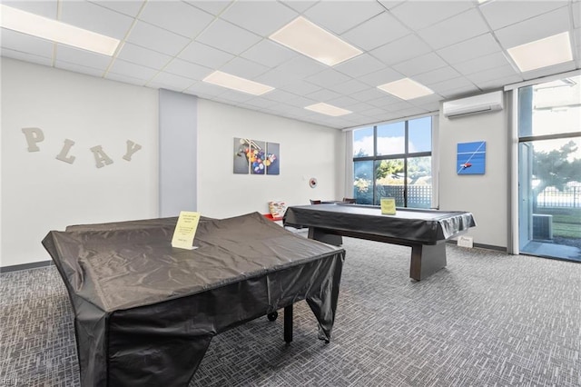 game room with a paneled ceiling, pool table, carpet flooring, and a wall mounted air conditioner