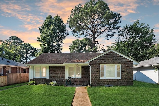 view of front of home with a yard