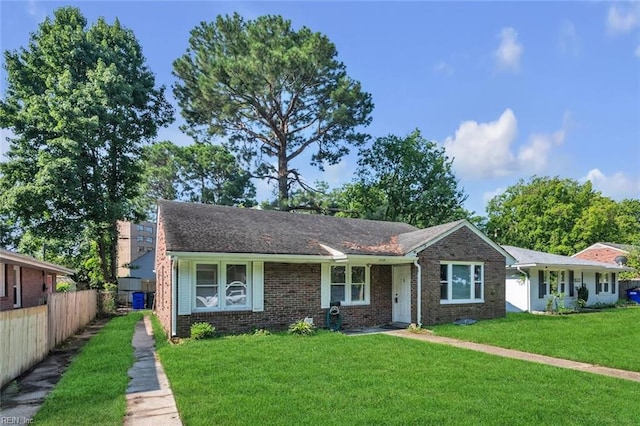 ranch-style home with a front lawn