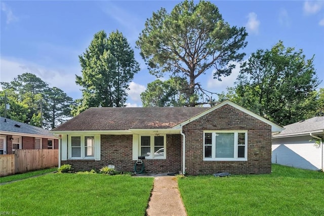 ranch-style home with a front yard