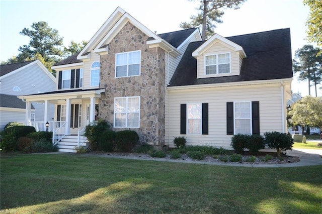 view of front of house featuring a front yard and covered porch