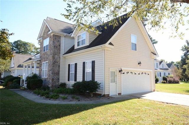 view of side of property with a yard and a garage