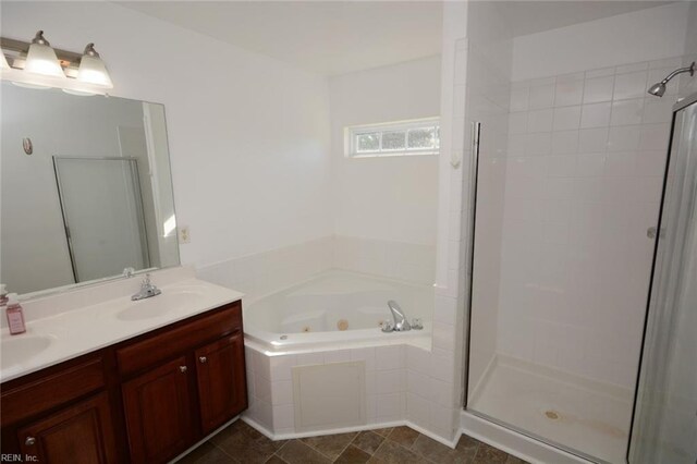 bathroom with vanity, shower with separate bathtub, and tile patterned floors