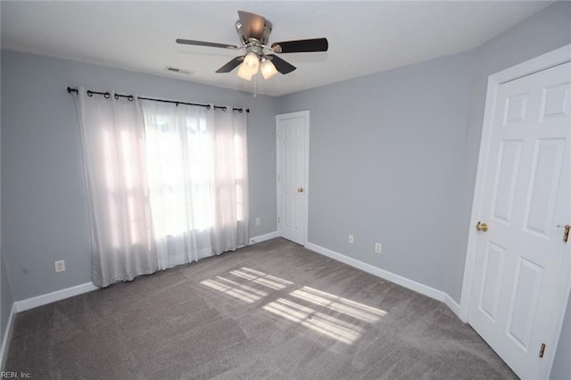 empty room with carpet flooring and ceiling fan