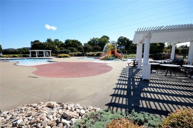 view of pool featuring a patio area and a pergola