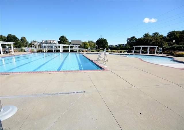 view of swimming pool featuring a patio area