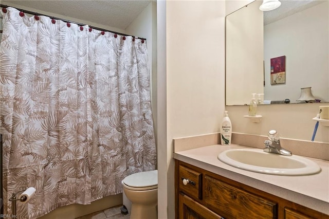 bathroom with tile patterned floors, toilet, curtained shower, vanity, and a textured ceiling