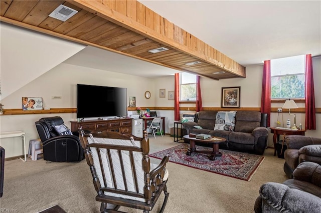 carpeted living room with wood ceiling