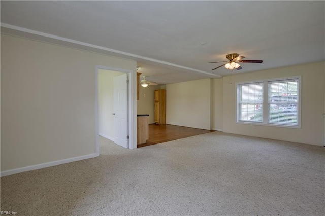 spare room with carpet flooring and ceiling fan