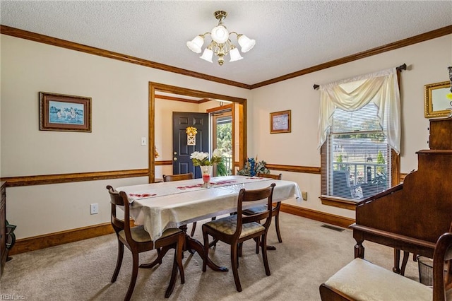 dining area with an inviting chandelier, a textured ceiling, and light colored carpet