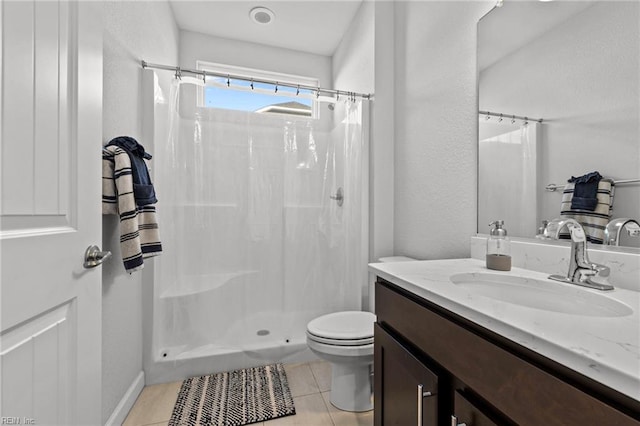 bathroom featuring vanity, walk in shower, toilet, and tile patterned flooring