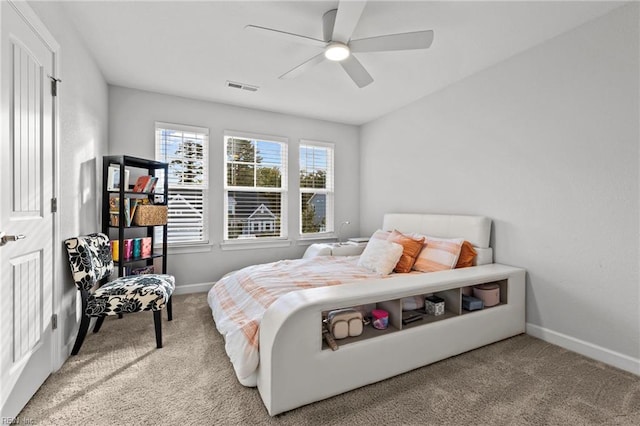 carpeted bedroom with ceiling fan