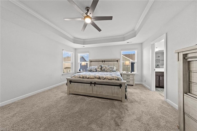 carpeted bedroom with crown molding, multiple windows, a tray ceiling, and ceiling fan