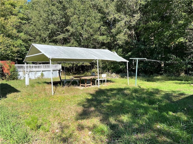 5225 Crumpler Rd, Ivor, VA 23866 - view of green lawn featuring a carport and a forest view
