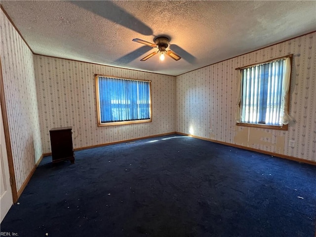 empty room with carpet, a textured ceiling, and ceiling fan