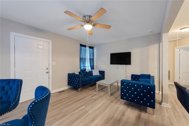 living area with light hardwood / wood-style flooring and ceiling fan