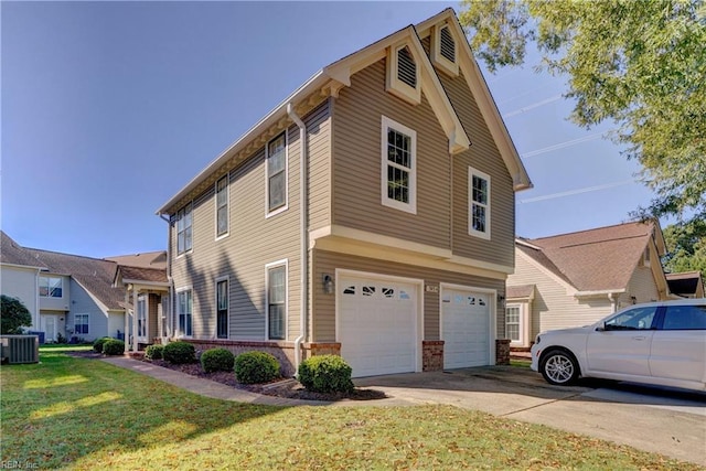 view of front of home featuring a front lawn, central AC unit, and a garage